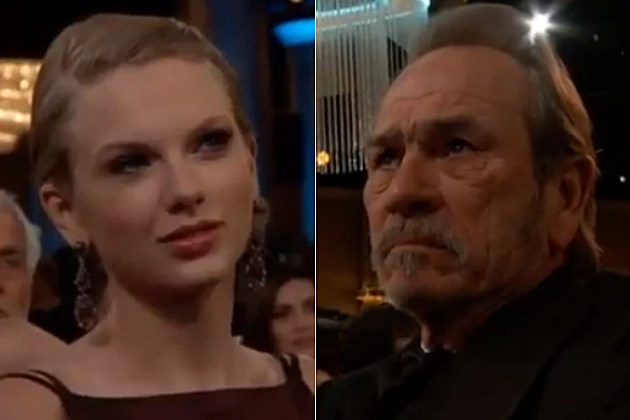 Taylor Swift and Tommy Lee Jones did a great job of acting not happy at the Golden Globes. Taylor Swift and Tommy Lee Jones did a great job of acting not happy at the Golden Globes.